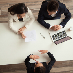 Employees working around a table