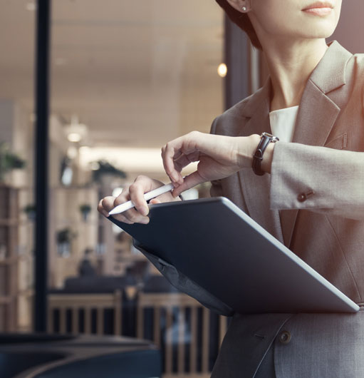 Woman checking kronos app on tablet