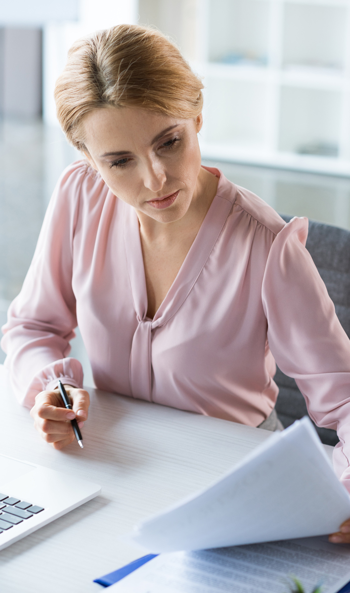 Employee reading life insurance documents