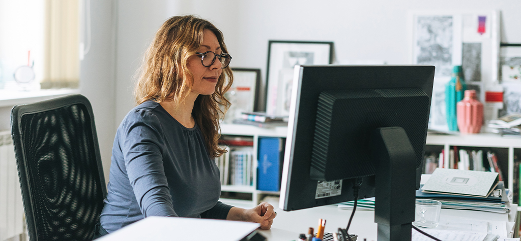 AI Powered Solutions - Female working on computer