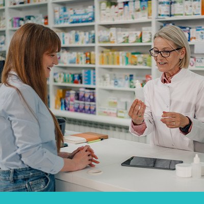 Female paying at Pharmacy